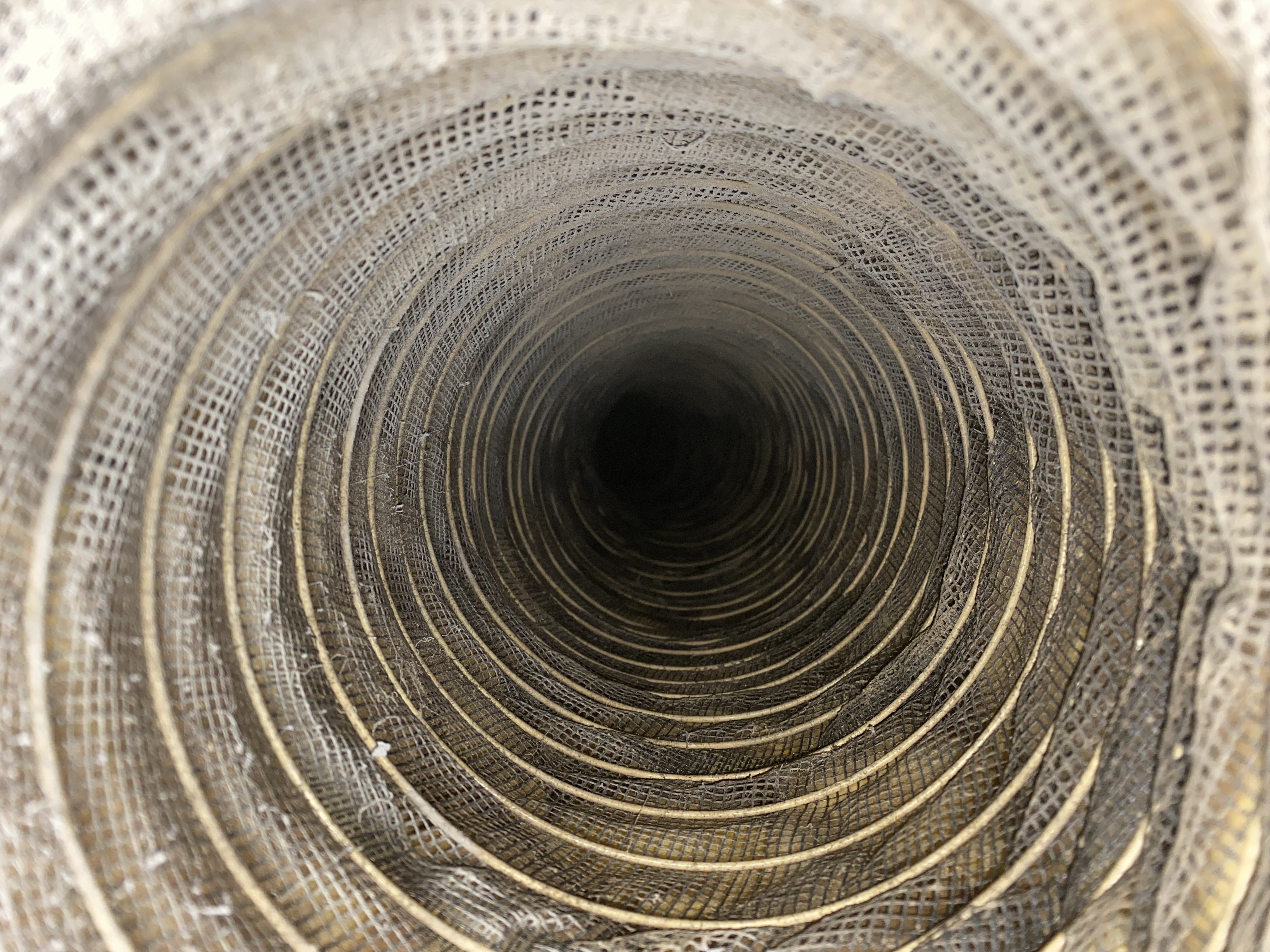 Lined duct with dirt, dust, and debris before cleaning, East Naples